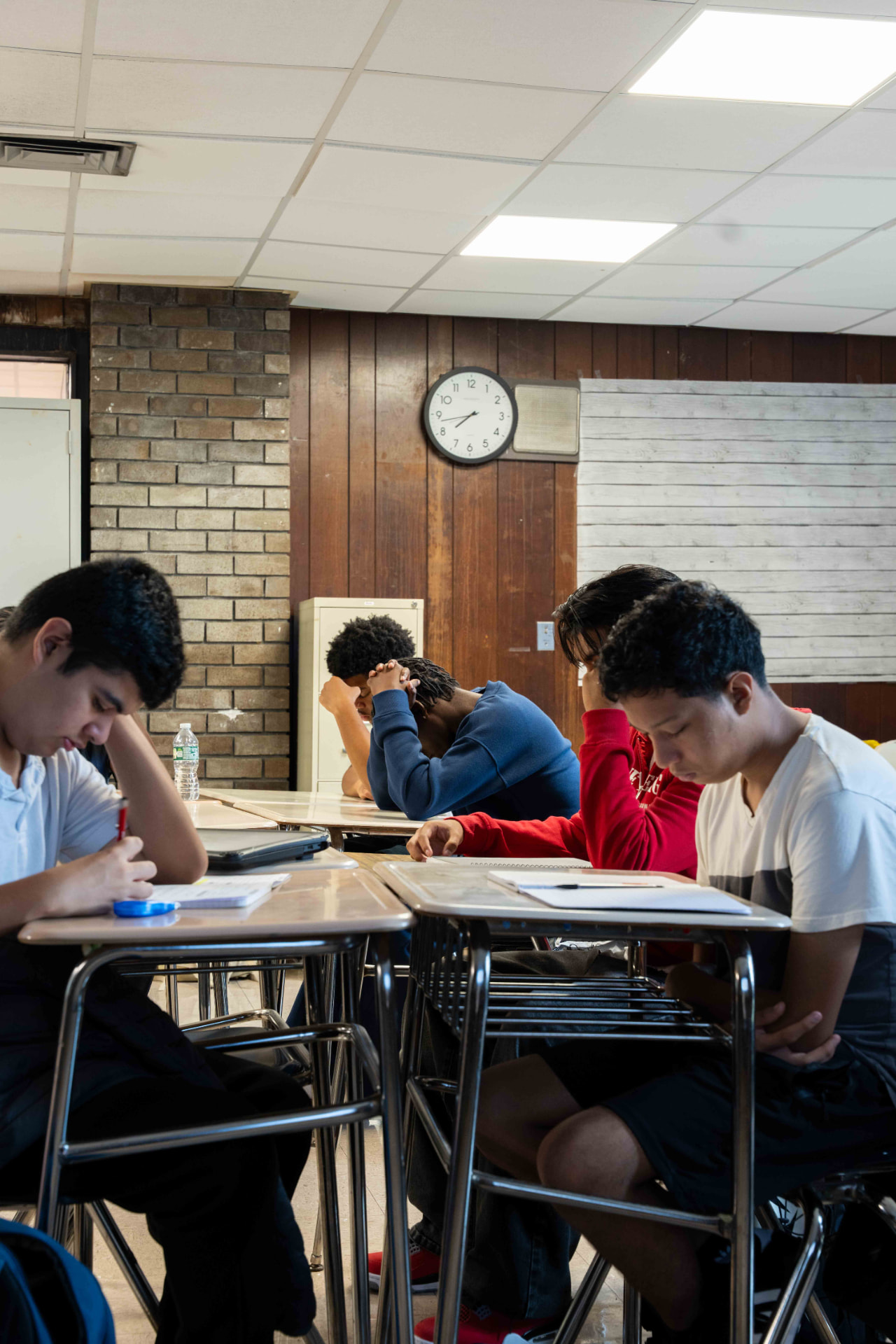 Students observing the Moment of Silence in a Hempstead High School classroom at 8:46 AM
