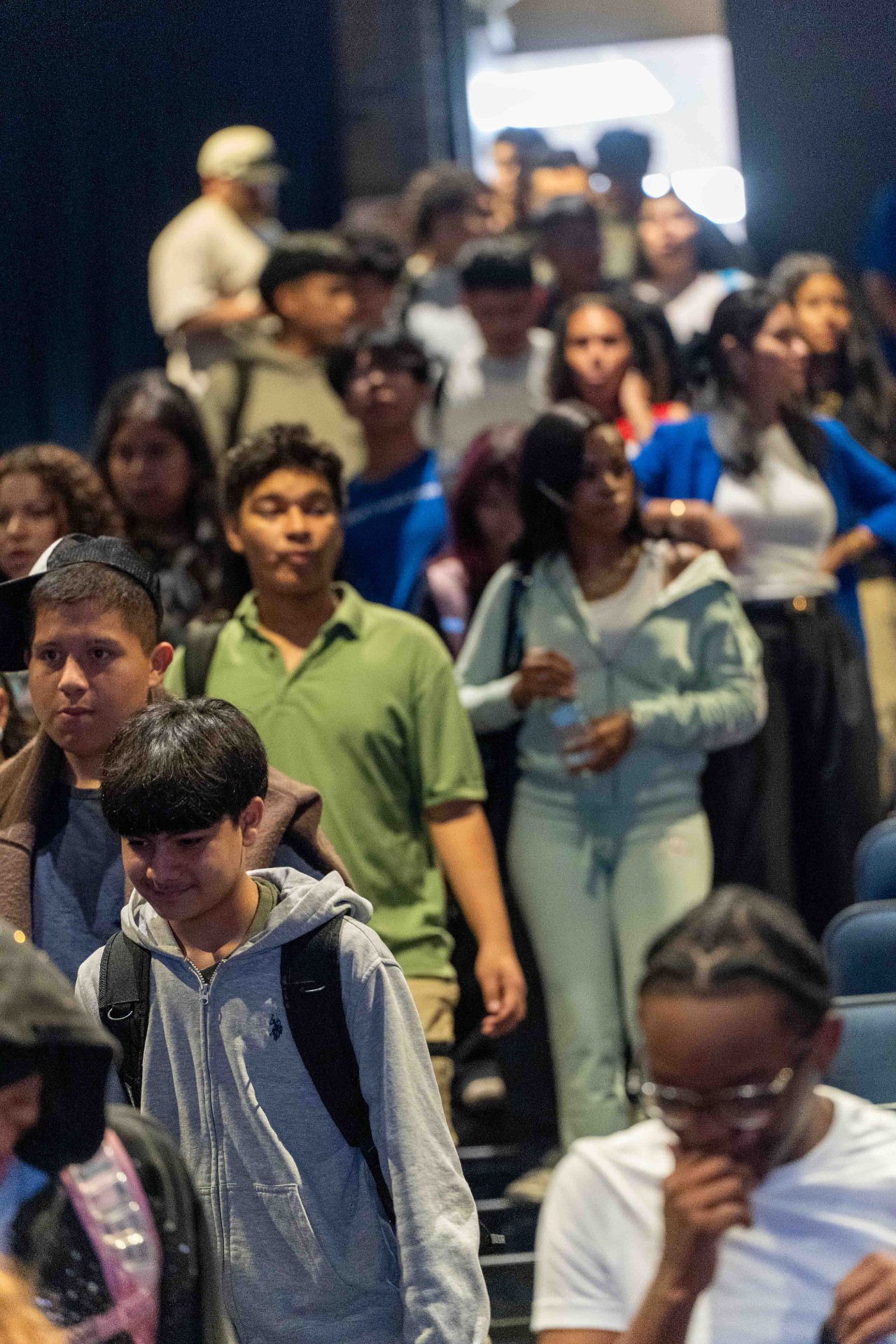 Students filing into the auditorium before the commemoration assembly
